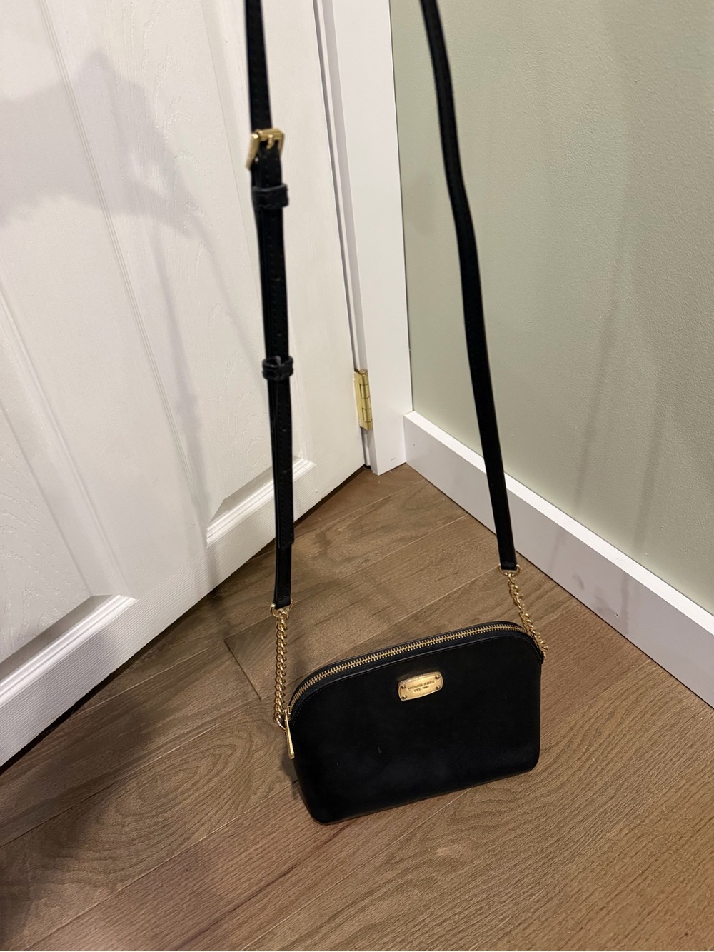 Black and gold crossbody Michael Kors purse